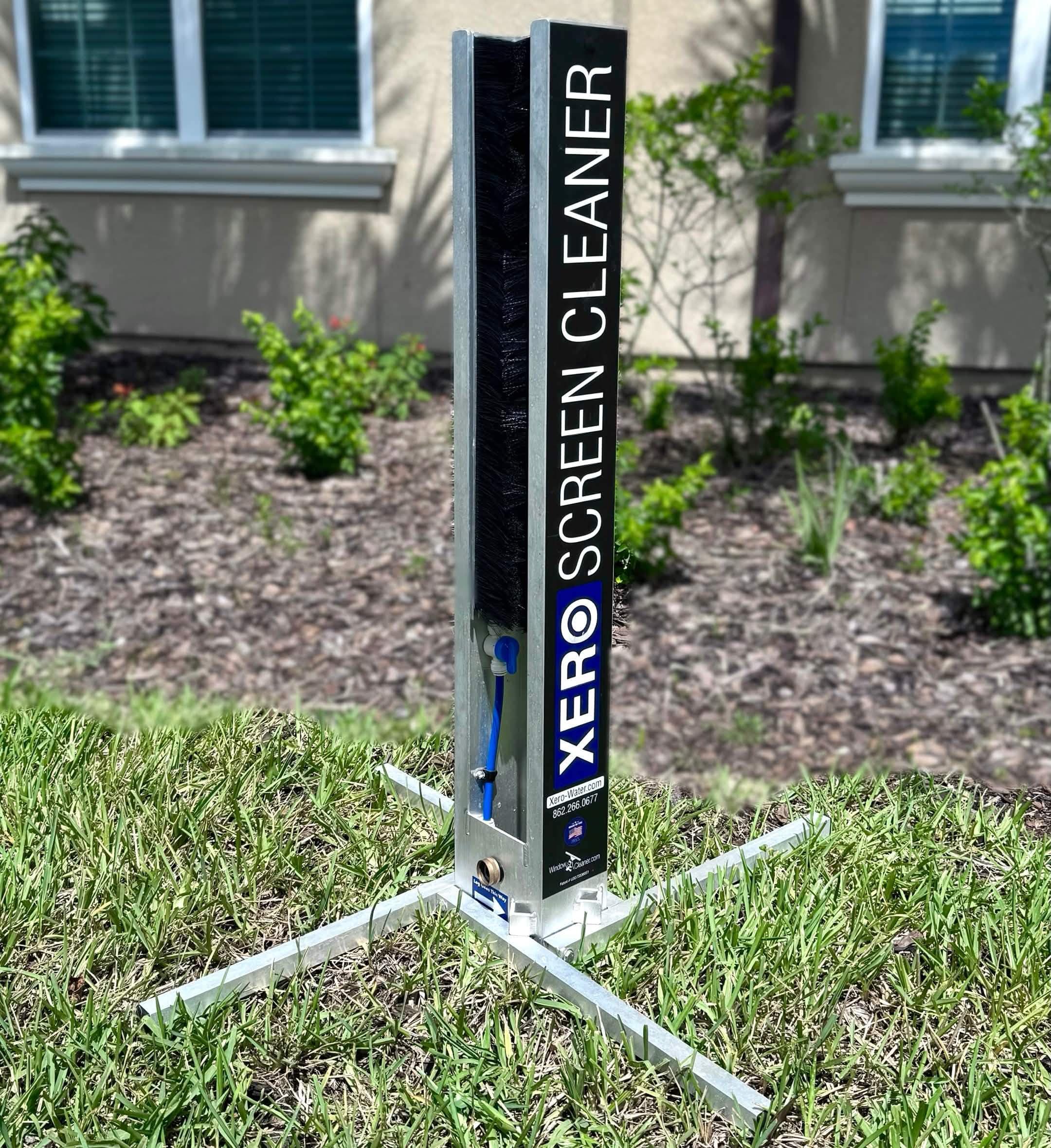 CrestFlow technician scrubbing a window screen with a specialty screen cleaning tool